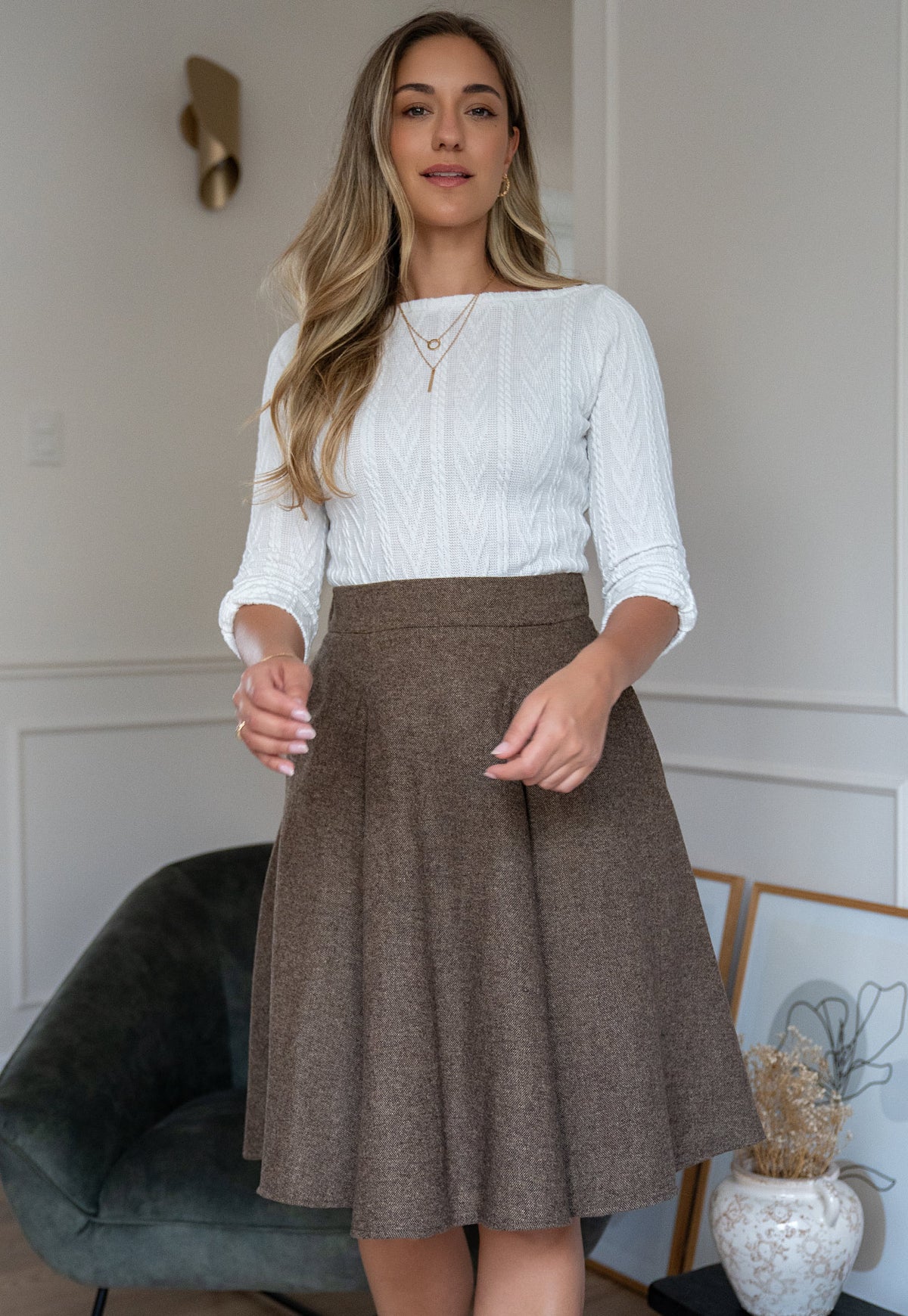 Women’s Aniz ivory textured cable-knit top with boat neckline and three-quarter sleeves by Elizabeth Lozano.